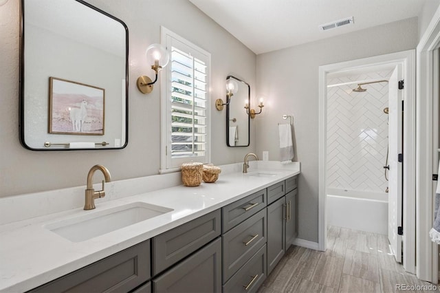 10660 Weathersfield Ct, Highlands Ranch, CO 80129 - full bathroom with double vanity and washtub / shower combination