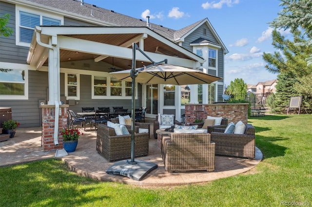 10660 Weathersfield Ct, Highlands Ranch, CO 80129 - back of house featuring outdoor lounge area, a lawn, a patio area, and ceiling fan