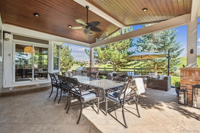 10660 Weathersfield Ct, Highlands Ranch, CO 80129 - view of patio with outdoor dining space, exterior kitchen, an outdoor hangout area, and a ceiling fan