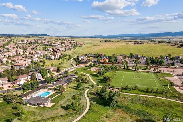 10660 Weathersfield Ct, Highlands Ranch, CO 80129 - aerial view of property's location with a mountain backdrop and a pool area