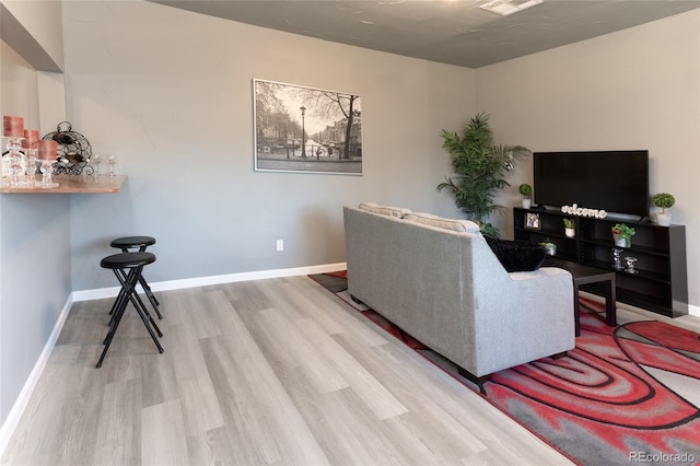 4595 S Lincoln St, Englewood, CO 80113 - living area with wood finished floors, visible vents, and baseboards