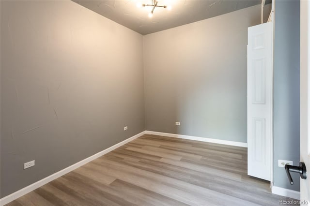 4595 S Lincoln St, Englewood, CO 80113 - spare room with a notable chandelier, baseboards, and wood finished floors