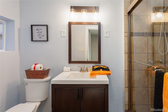 4595 S Lincoln St, Englewood, CO 80113 - bathroom with tiled shower, vanity, and toilet