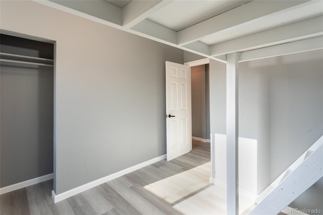 4595 S Lincoln St, Englewood, CO 80113 - unfurnished bedroom featuring baseboards, wood finished floors, and a closet