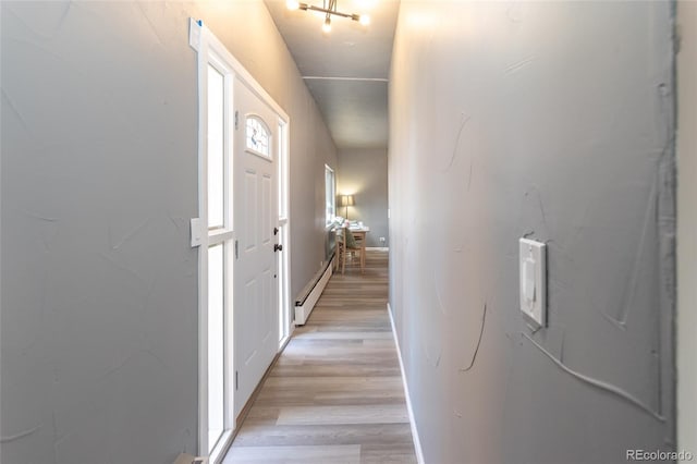 4595 S Lincoln St, Englewood, CO 80113 - hallway with light wood-type flooring and a baseboard radiator