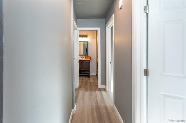 4595 S Lincoln St, Englewood, CO 80113 - hall featuring light wood finished floors and baseboards