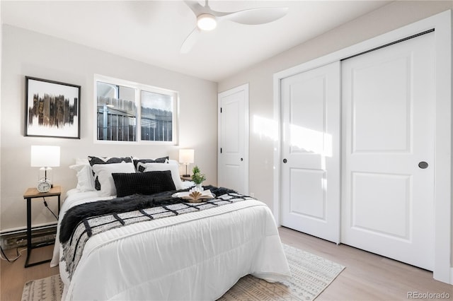 bedroom featuring light wood-type flooring and ceiling fan