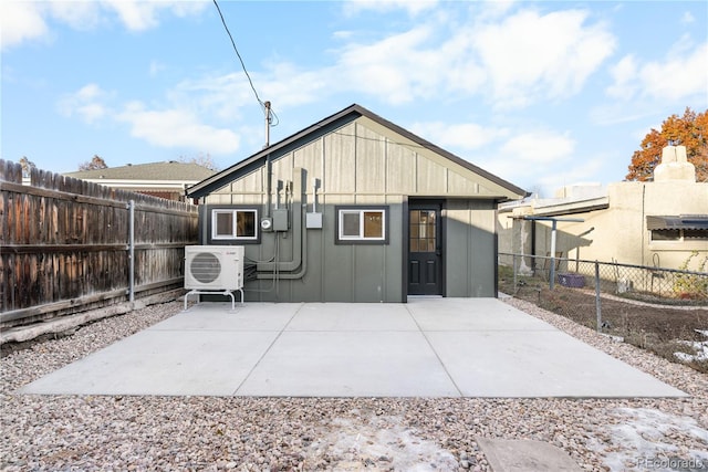 rear view of house featuring a patio area and ac unit