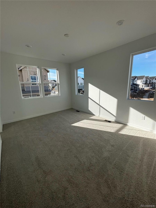 unfurnished living room featuring carpet