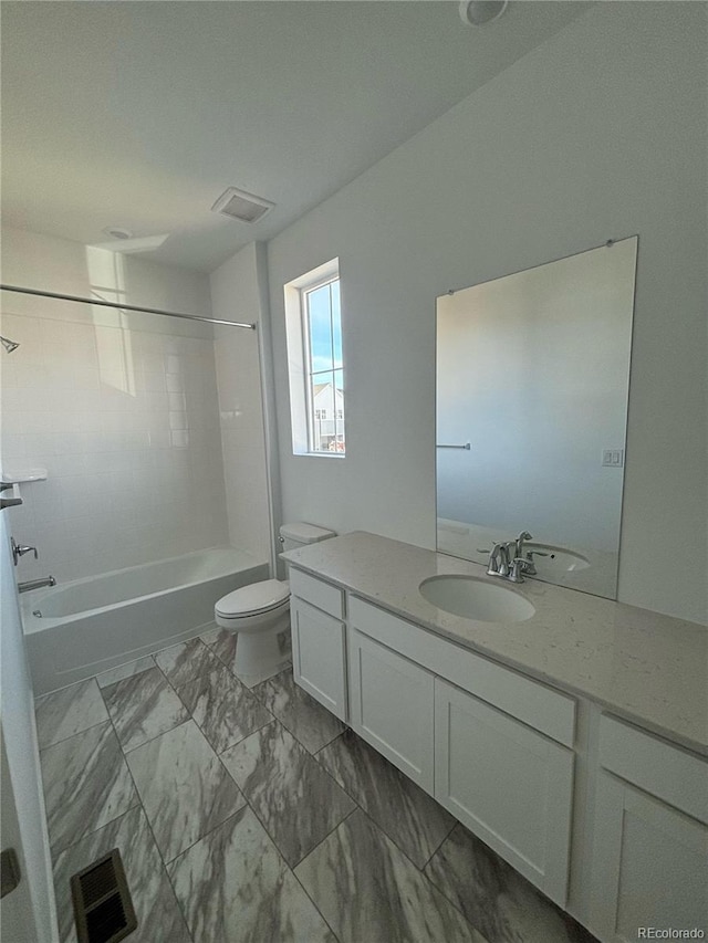 full bathroom featuring bathtub / shower combination, vanity, and toilet