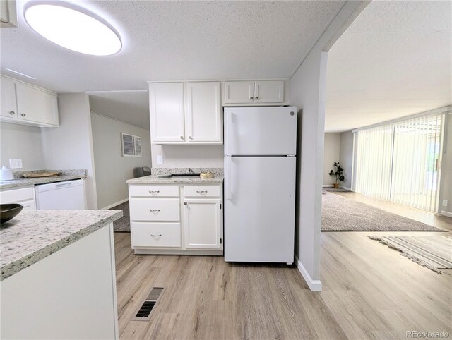 2032 Tulane St, Denver, CO 80260 - kitchen with white appliances, light wood finished floors, and white cabinets