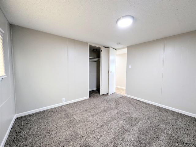 2032 Tulane St, Denver, CO 80260 - unfurnished bedroom with carpet floors, a closet, and a textured ceiling