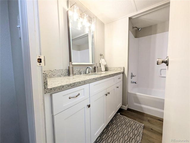 2032 Tulane St, Denver, CO 80260 - bathroom with vanity, wood finished floors, and shower / washtub combination
