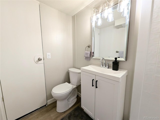 2032 Tulane St, Denver, CO 80260 - half bathroom featuring vanity and wood finished floors