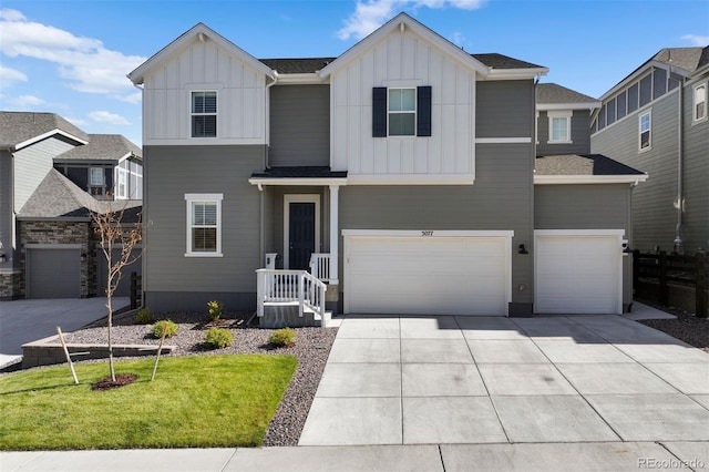 view of front of home with a front yard and a garage