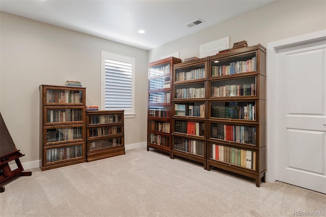 living area featuring light colored carpet