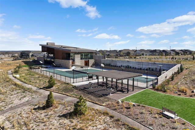 view of swimming pool featuring a yard