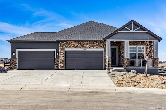 view of front of property with a porch, concrete driveway, roof with shingles, a garage, and stone siding