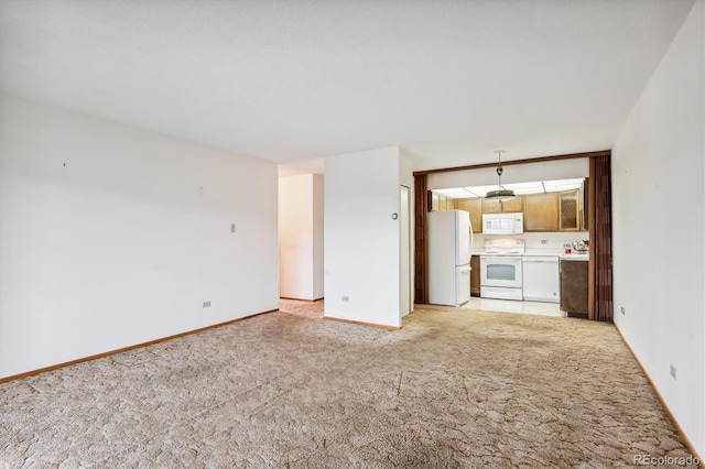 unfurnished living room with light carpet