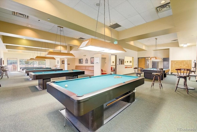 rec room with a towering ceiling, carpet flooring, and pool table