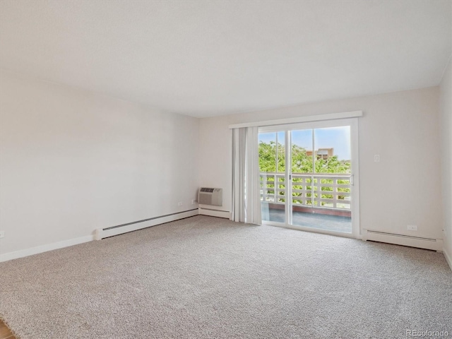 635 S Alton Way Unit 1C, Denver, CO 80247 - spare room with a baseboard radiator, carpet floors, and a wall mounted AC