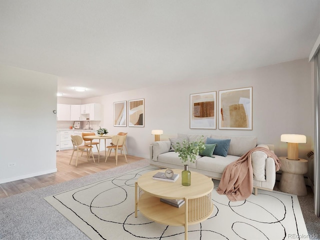 635 S Alton Way Unit 1C, Denver, CO 80247 - living area with light wood-style floors and baseboards