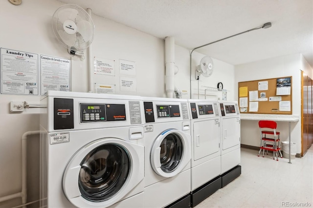 635 S Alton Way Unit 1C, Denver, CO 80247 - community laundry with washing machine and dryer and light flooring