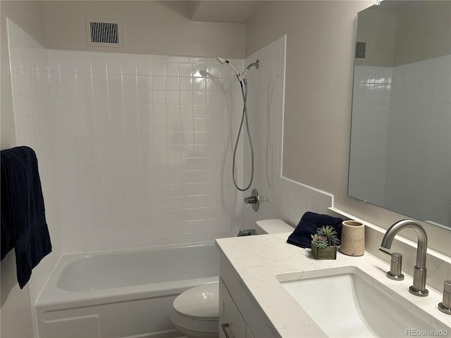 635 S Alton Way Unit 1C, Denver, CO 80247 - bathroom featuring toilet, vanity, and shower / tub combination