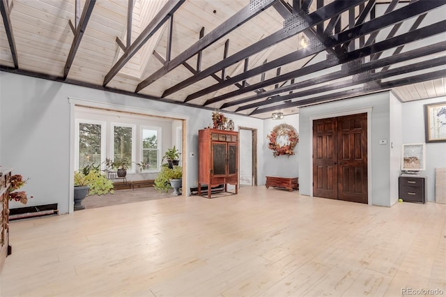 1341 Tomichi Dr, Franktown, CO 80116 - living room featuring beam ceiling, high vaulted ceiling, and wood finished floors