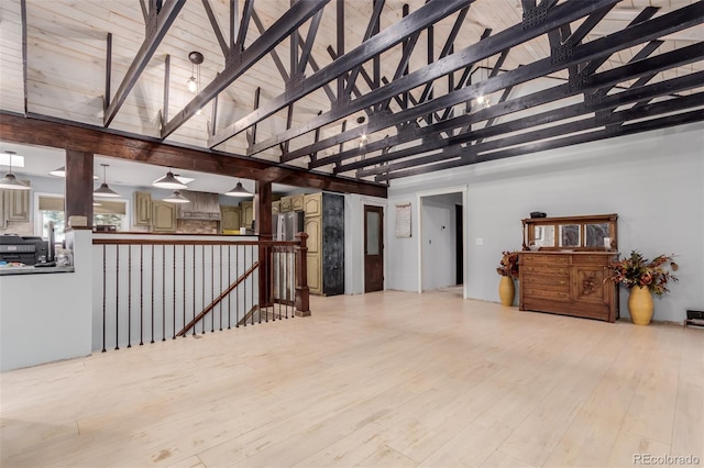 1341 Tomichi Dr, Franktown, CO 80116 - unfurnished living room with high vaulted ceiling, light wood finished floors, and beamed ceiling