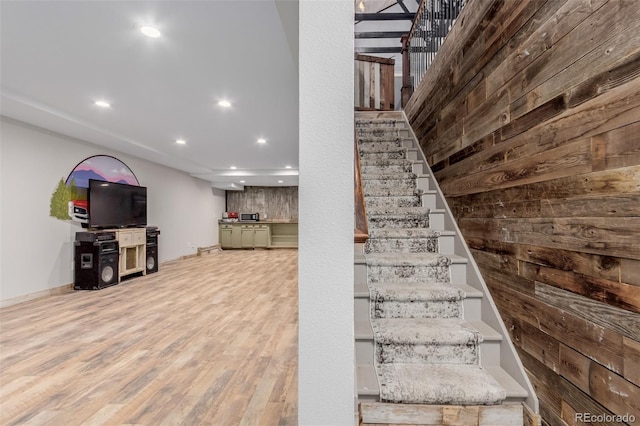 1341 Tomichi Dr, Franktown, CO 80116 - stairs with recessed lighting, wood finished floors, and baseboards