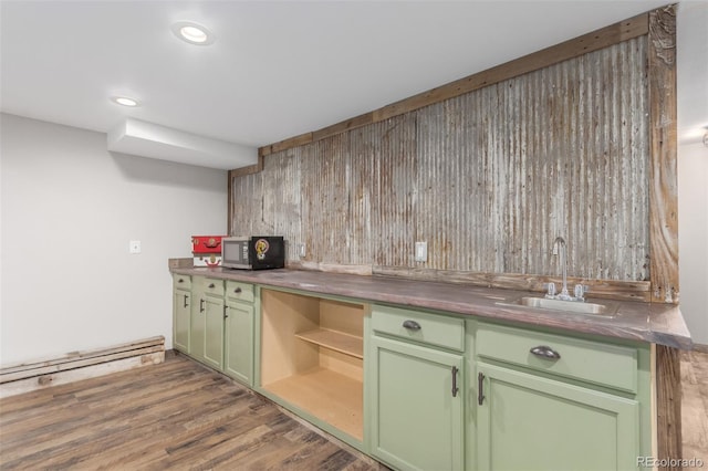 1341 Tomichi Dr, Franktown, CO 80116 - bar with stainless steel microwave, a sink, wood finished floors, a baseboard heating unit, and recessed lighting