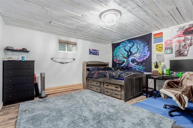 1341 Tomichi Dr, Franktown, CO 80116 - bedroom with a baseboard radiator, wooden ceiling, wood finished floors, and baseboards