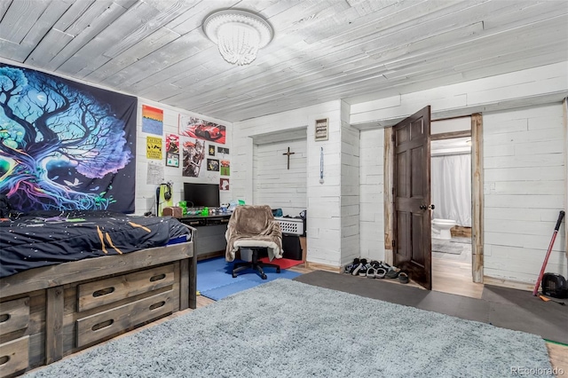 1341 Tomichi Dr, Franktown, CO 80116 - bedroom with finished concrete flooring, wooden ceiling, and wooden walls