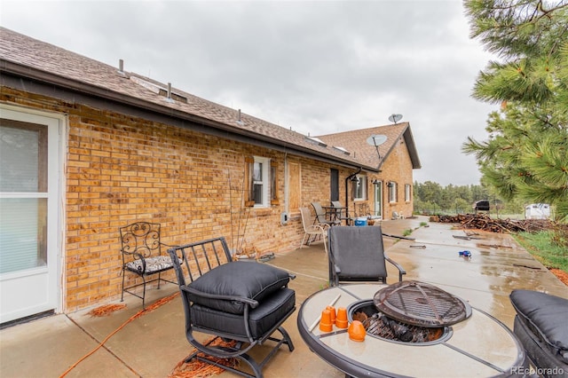 1341 Tomichi Dr, Franktown, CO 80116 - view of patio with a fire pit
