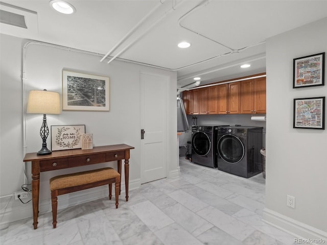 washroom featuring recessed lighting, marble finish floor, washer and clothes dryer, baseboards, and cabinet space