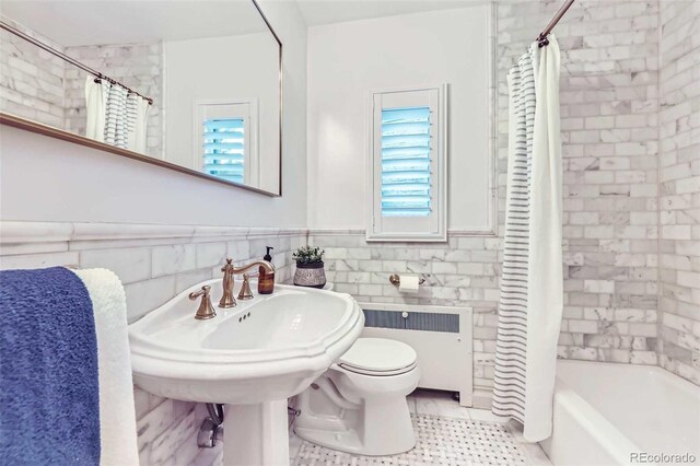 926 S Fillmore Way, Denver, CO 80209 - full bath featuring radiator, plenty of natural light, toilet, shower / tub combo, and tile walls