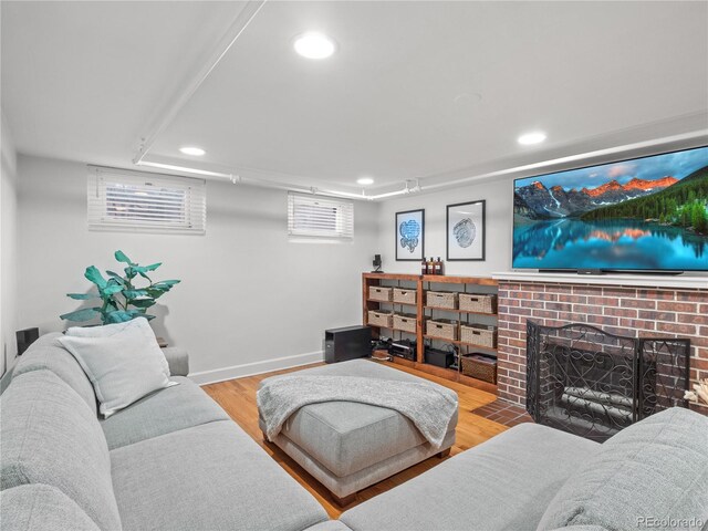 926 S Fillmore Way, Denver, CO 80209 - living area featuring recessed lighting, wood finished floors, a brick fireplace, and baseboards