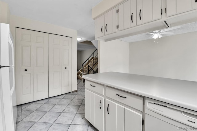 3061 W 92nd Ave Unit 8B, Westminster, CO 80031 - kitchen with a ceiling fan, light countertops, light tile patterned floors, white appliances, and white cabinetry