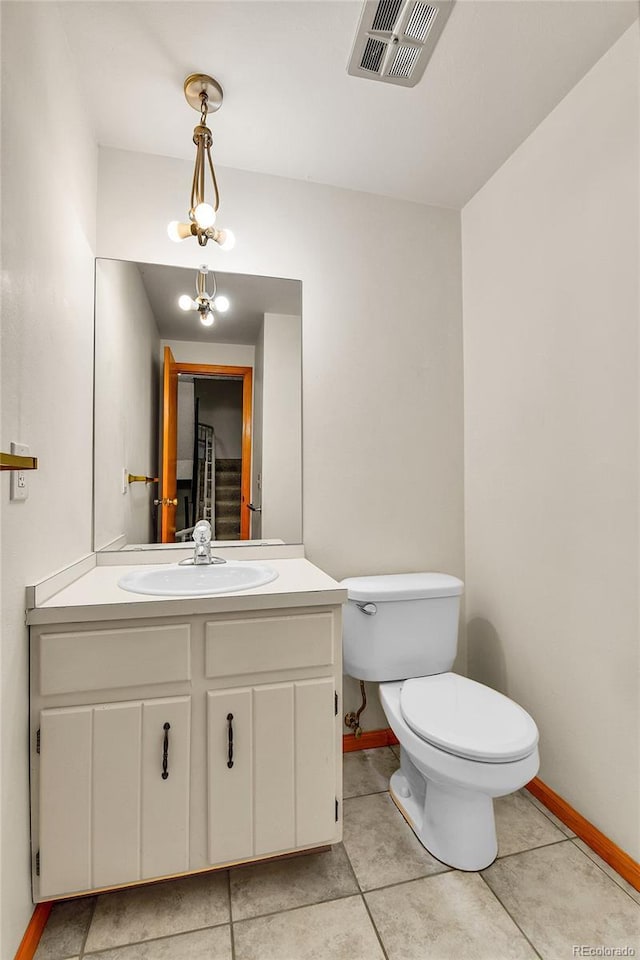 3061 W 92nd Ave Unit 8B, Westminster, CO 80031 - bathroom featuring toilet, baseboards, visible vents, and vanity