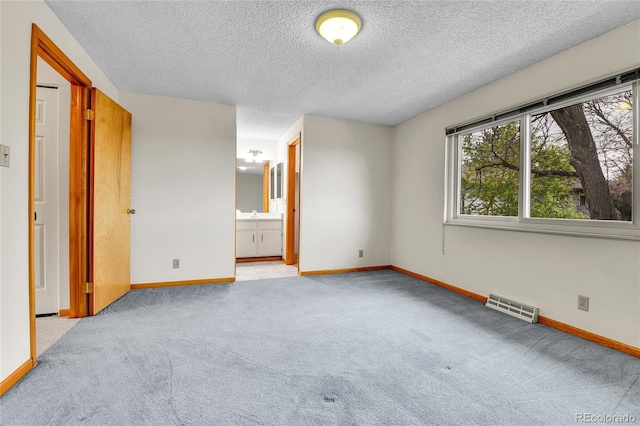 3061 W 92nd Ave Unit 8B, Westminster, CO 80031 - empty room with baseboards, carpet flooring, a textured ceiling, and visible vents