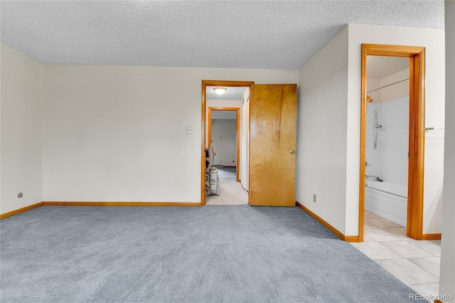 3061 W 92nd Ave Unit 8B, Westminster, CO 80031 - unfurnished bedroom with baseboards, carpet flooring, and a textured ceiling
