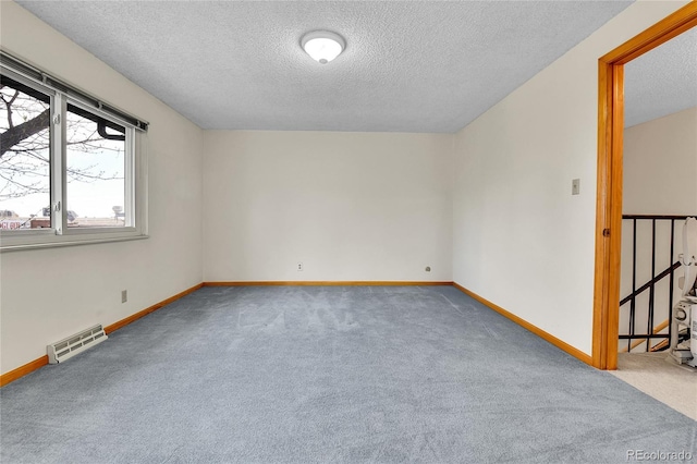 3061 W 92nd Ave Unit 8B, Westminster, CO 80031 - unfurnished room with baseboards, carpet flooring, a textured ceiling, and visible vents