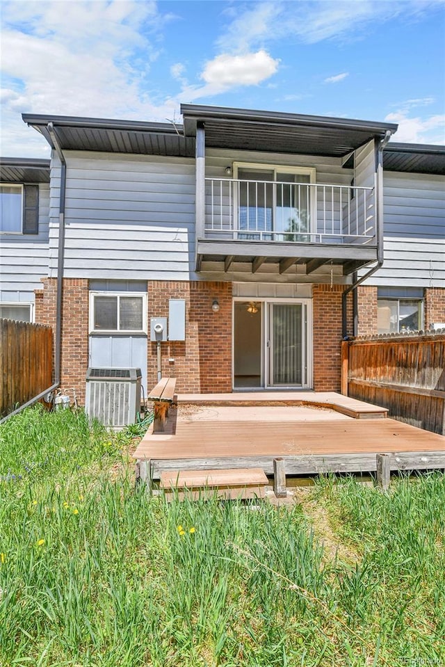3061 W 92nd Ave Unit 8B, Westminster, CO 80031 - rear view of property with central air condition unit, fence, a wooden deck, and a balcony