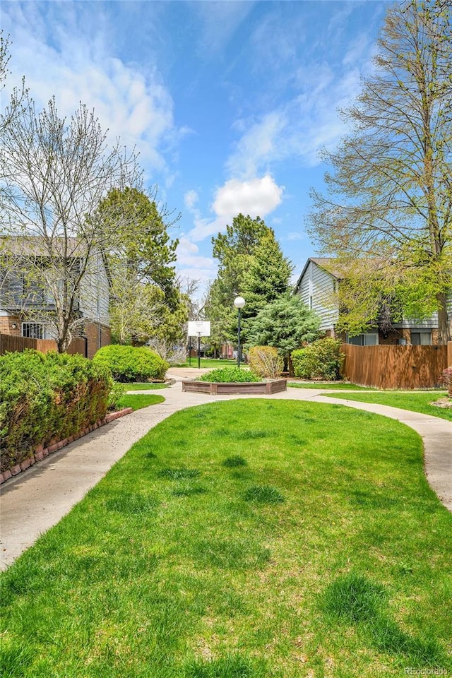 3061 W 92nd Ave Unit 8B, Westminster, CO 80031 - view of property's community featuring a lawn and fence