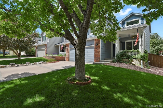 9665 Whitecliff Pl, Highlands Ranch, CO 80129 - view of property hidden behind natural elements with covered porch, concrete driveway, a front yard, and a garage