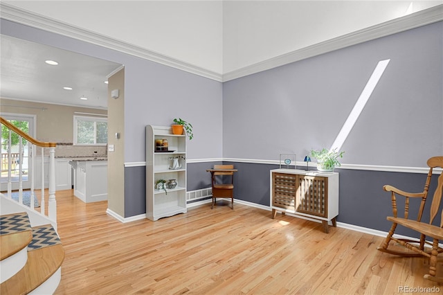 9665 Whitecliff Pl, Highlands Ranch, CO 80129 - living area with wood finished floors, recessed lighting, baseboards, stairway, and crown molding