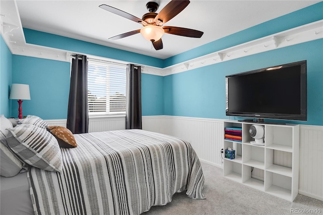 9665 Whitecliff Pl, Highlands Ranch, CO 80129 - carpeted bedroom featuring wainscoting and a ceiling fan