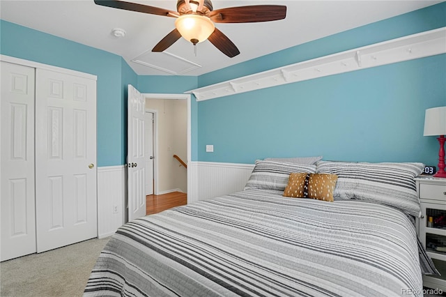 9665 Whitecliff Pl, Highlands Ranch, CO 80129 - carpeted bedroom with a wainscoted wall, attic access, a closet, and a ceiling fan