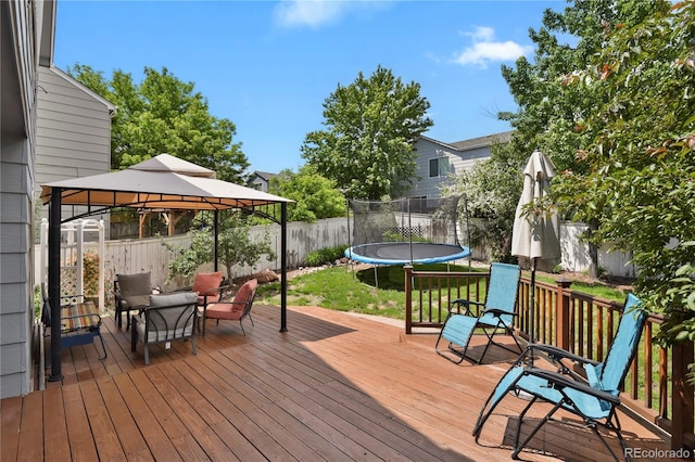 9665 Whitecliff Pl, Highlands Ranch, CO 80129 - wooden terrace featuring a trampoline and a gazebo